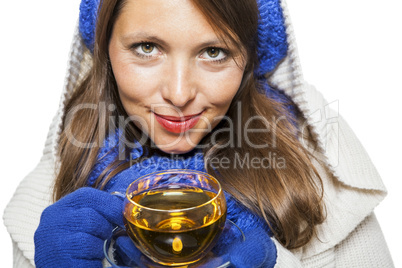 Fashionable young woman sipping hot tea
