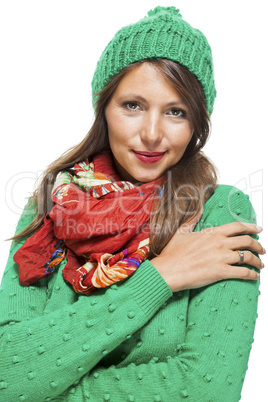 Cute sexy young woman in a green winter outfit