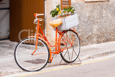 orange ladies bicycle with flowers decoration