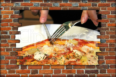 broken brick wall and view to fork knife and tasty pizza