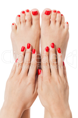 Woman with beautiful red finger and toenails