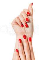 Woman with beautiful manicured red fingernails