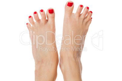 Female feet with red nails