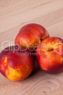 Three tasty fresh ripe juicy nectarines