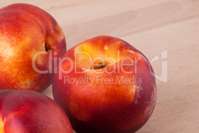 Three tasty fresh ripe juicy nectarines