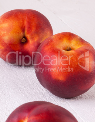 Three tasty fresh ripe juicy nectarines