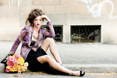 attractive young woman with pink roses