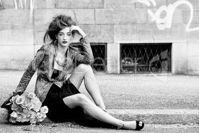 attractive young woman with pink roses