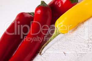 Fresh red and yellow chili peppers with spice