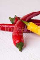 Fresh red and yellow chili peppers with spice