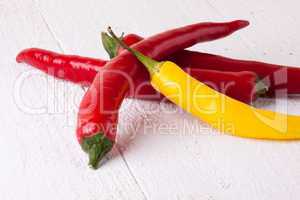 Fresh red and yellow chili peppers with spice