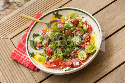 Bowl of Marinated Greek Salad with Red Napkin