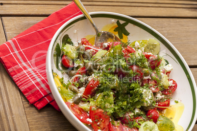 Bowl of Marinated Greek Salad with Red Napkin
