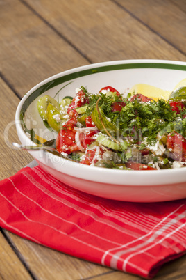 Bowl of Marinated Greek Salad with Red Napkin