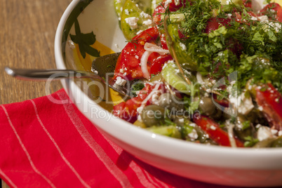 Bowl of Marinated Greek Salad with Red Napkin