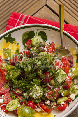 Bowl of Marinated Greek Salad with Red Napkin