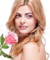 beautiful blond woman portrait with pink rose