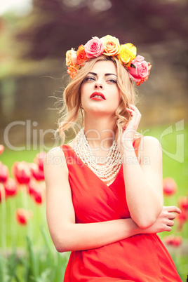 beautiful woman portrait outdoor with colorful flowers