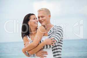 smiling young couple having fun in summer holiday