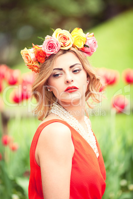 beautiful woman portrait outdoor with colorful flowers