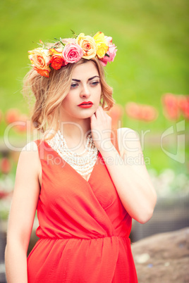 beautiful woman portrait outdoor with colorful flowers