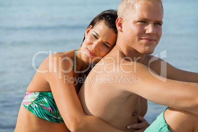 Happy young couple sunbathing