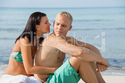 Happy young couple sunbathing