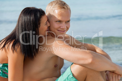 Happy young couple sunbathing