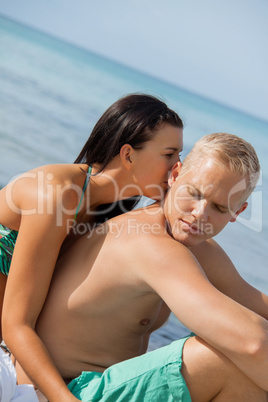 Happy young couple sunbathing