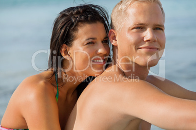 Happy young couple sunbathing