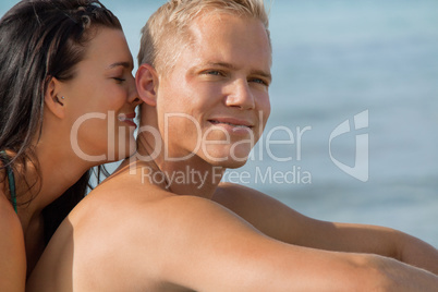 Happy young couple sunbathing