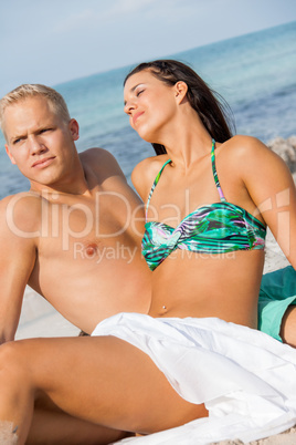 Happy young couple sunbathing
