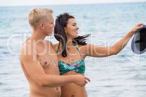 smiling young couple having fun in summer holiday