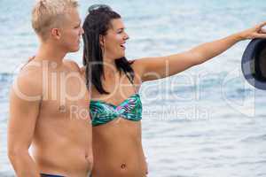 smiling young couple having fun in summer holiday