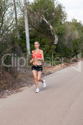 Fit young woman jogging