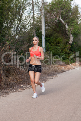 Fit young woman jogging