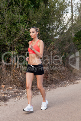 Fit young woman jogging
