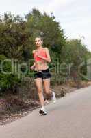 Fit young woman jogging