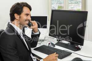Successful businessman working in his office
