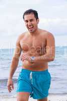 attractive young athletic man on the beach