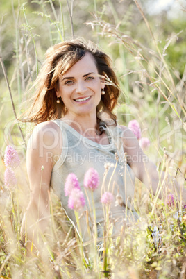 adult brunette woman smiling in summertime outdoor