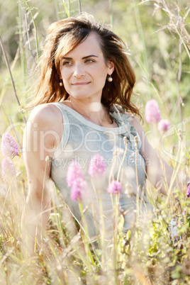 adult brunette woman smiling in summertime outdoor