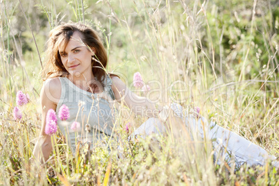 adult brunette woman smiling in summertime outdoor