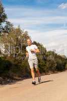 athletic man runner jogging in nature outdoor