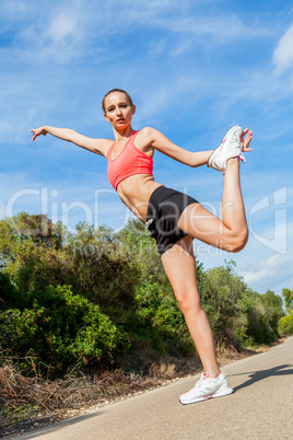 young attractive athletic woman stretching fitness