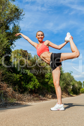 young attractive athletic woman stretching fitness