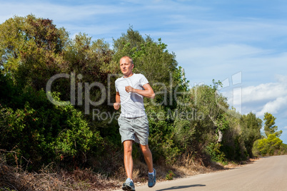 athletic man runner jogging in nature outdoor