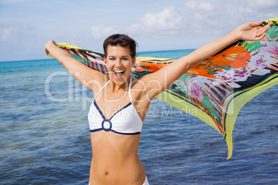 Laughing vivacious woman at the seaside