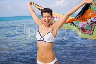 Laughing vivacious woman at the seaside