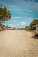 empty road in sunlight blue sky destination